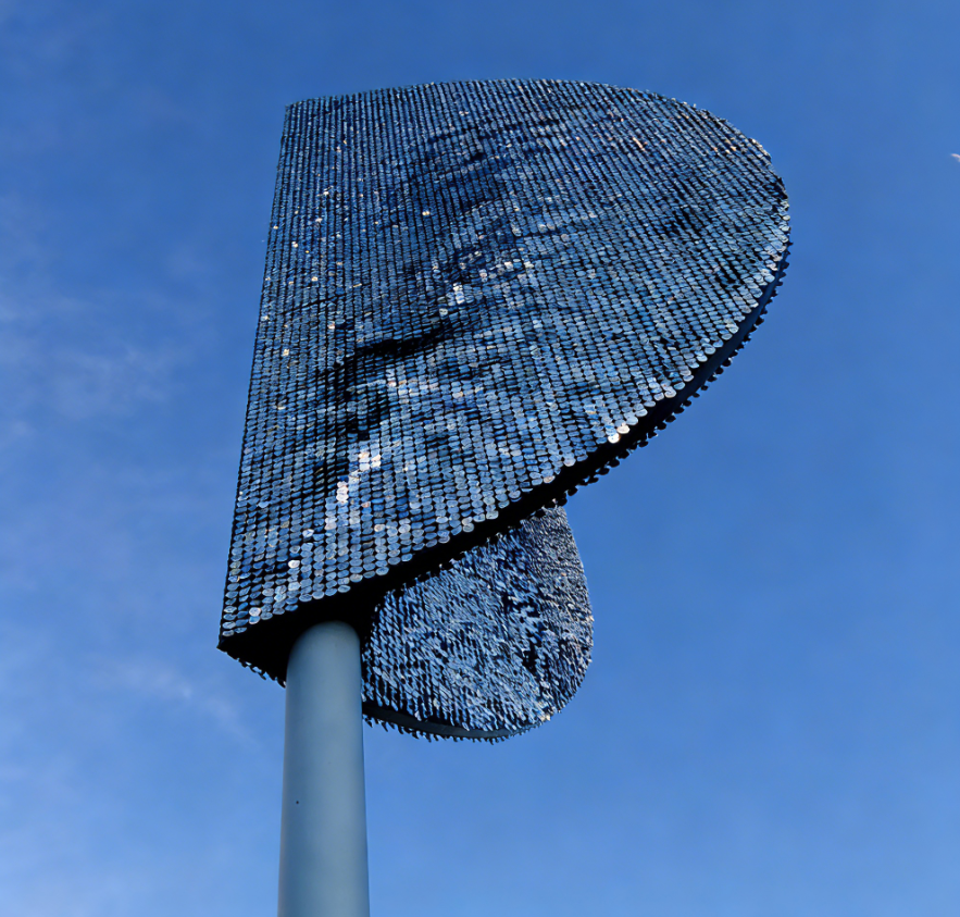 Wind driven kinetic facade panels with stainless steel pixel plates