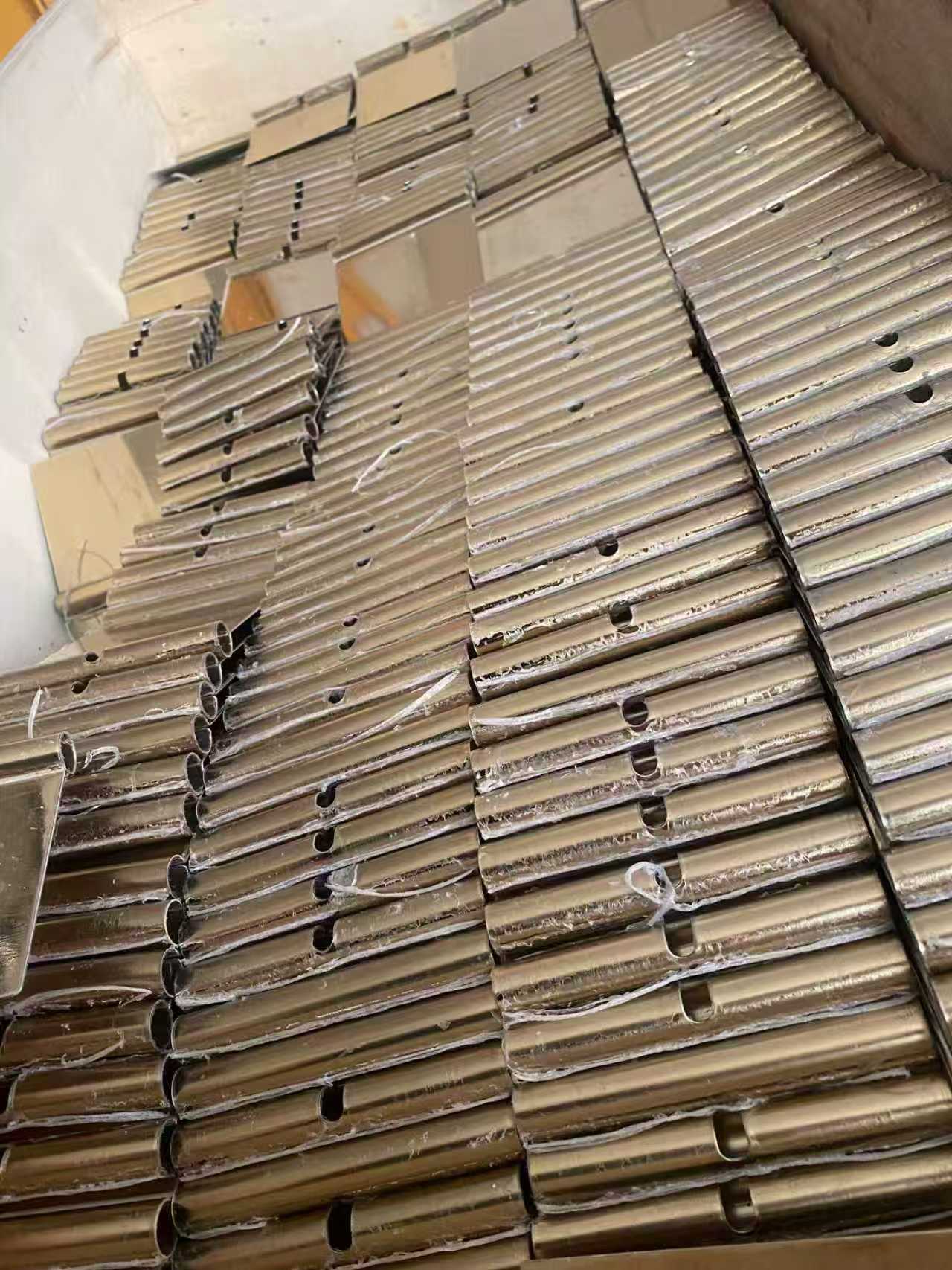 Custom stainless steel kinetic facade panels for wind-driven walls