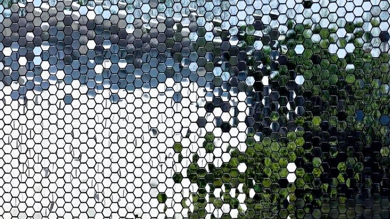 Close view of a kinetic wall art surface and moving modules