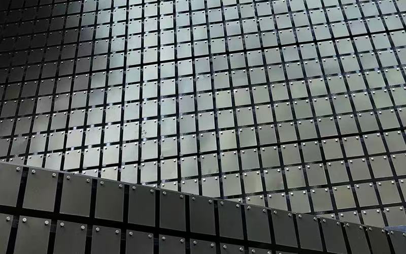 Precision Stamped Wind-Activated Facade Components